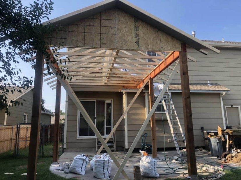 Exterior addition with new roof structure and framing