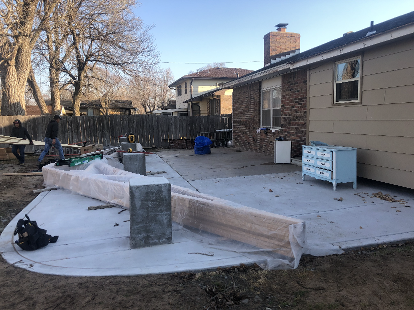 Completed patio with stone seating area
