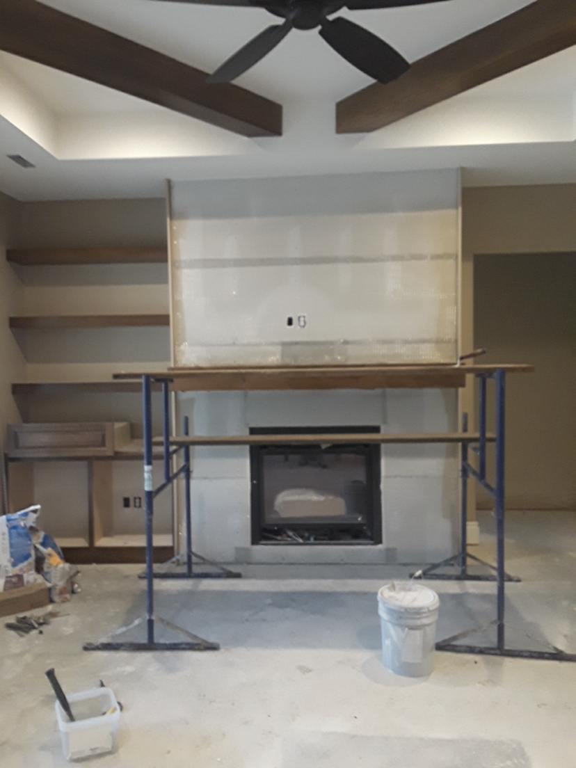 Finished living space with fireplace and ceiling detail