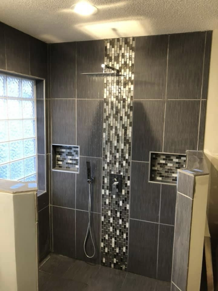 Luxury marble tile shower with custom fixtures