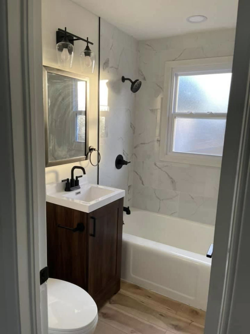 Full bathroom renovation with vanity and tub combo