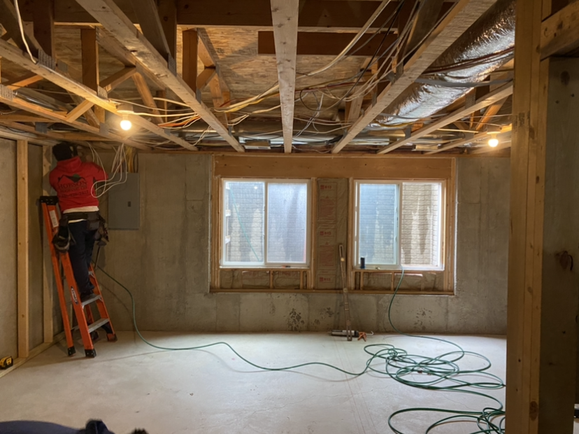 Before — unfinished basement framing