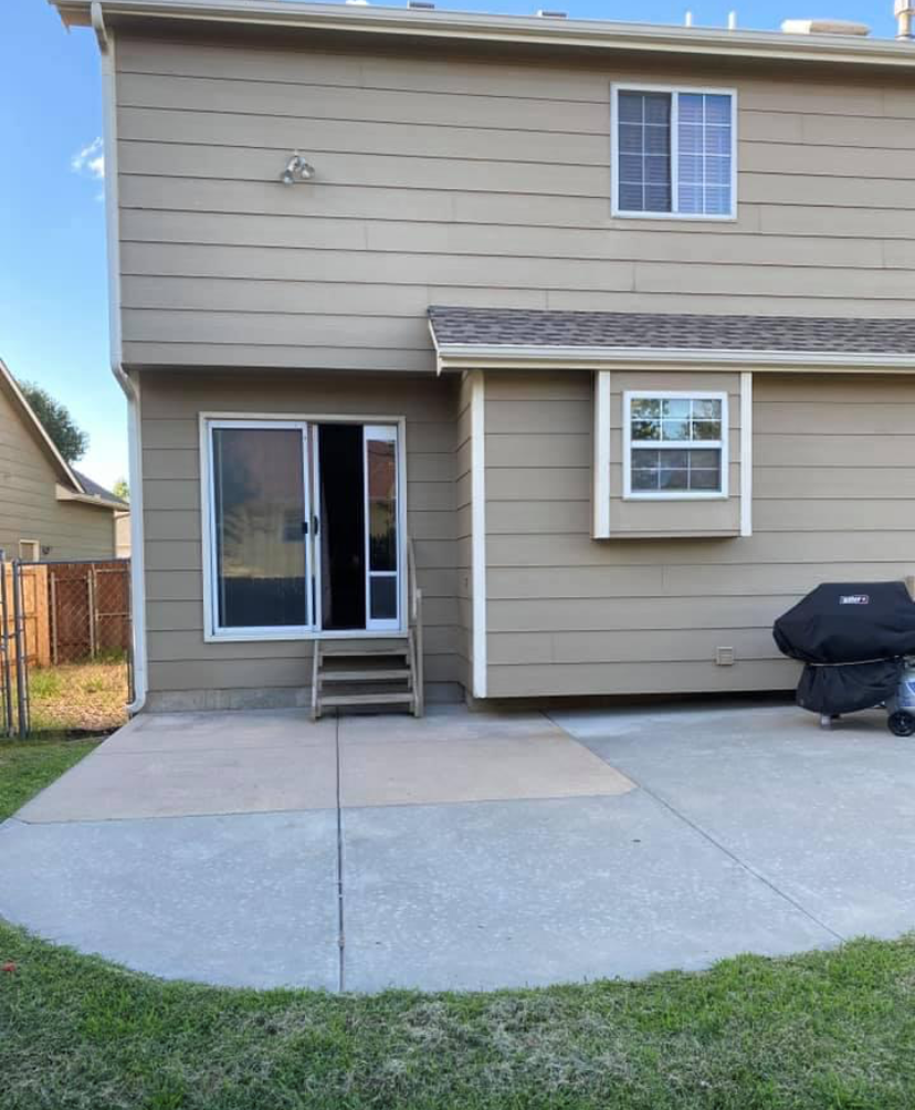Before — bare concrete patio