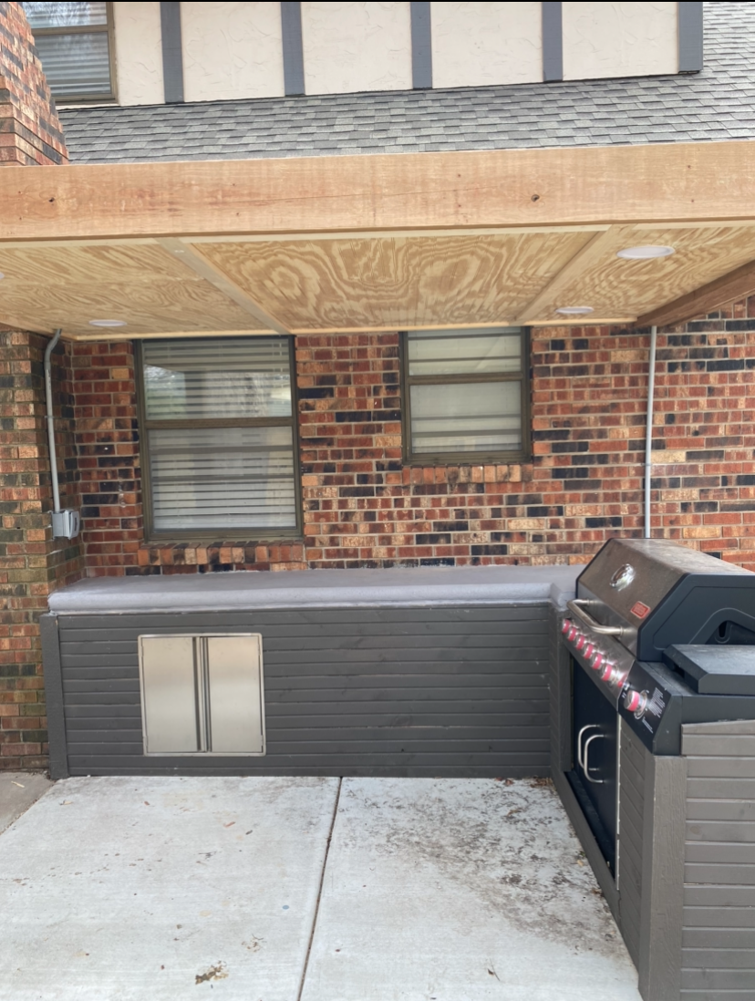 After — finished outdoor kitchen with pergola